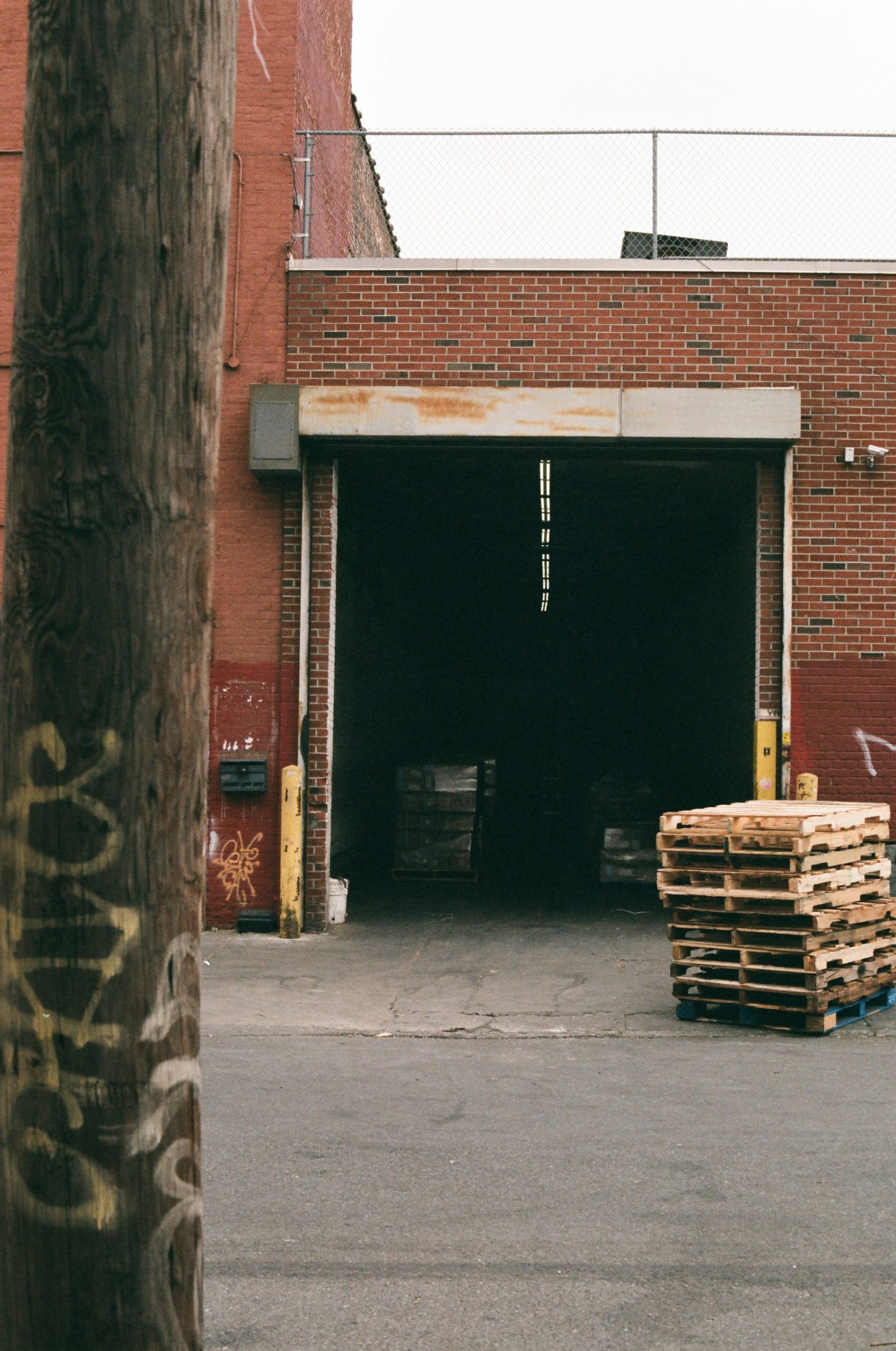 Warehouse loading dock with stacked pallets for industrial supply