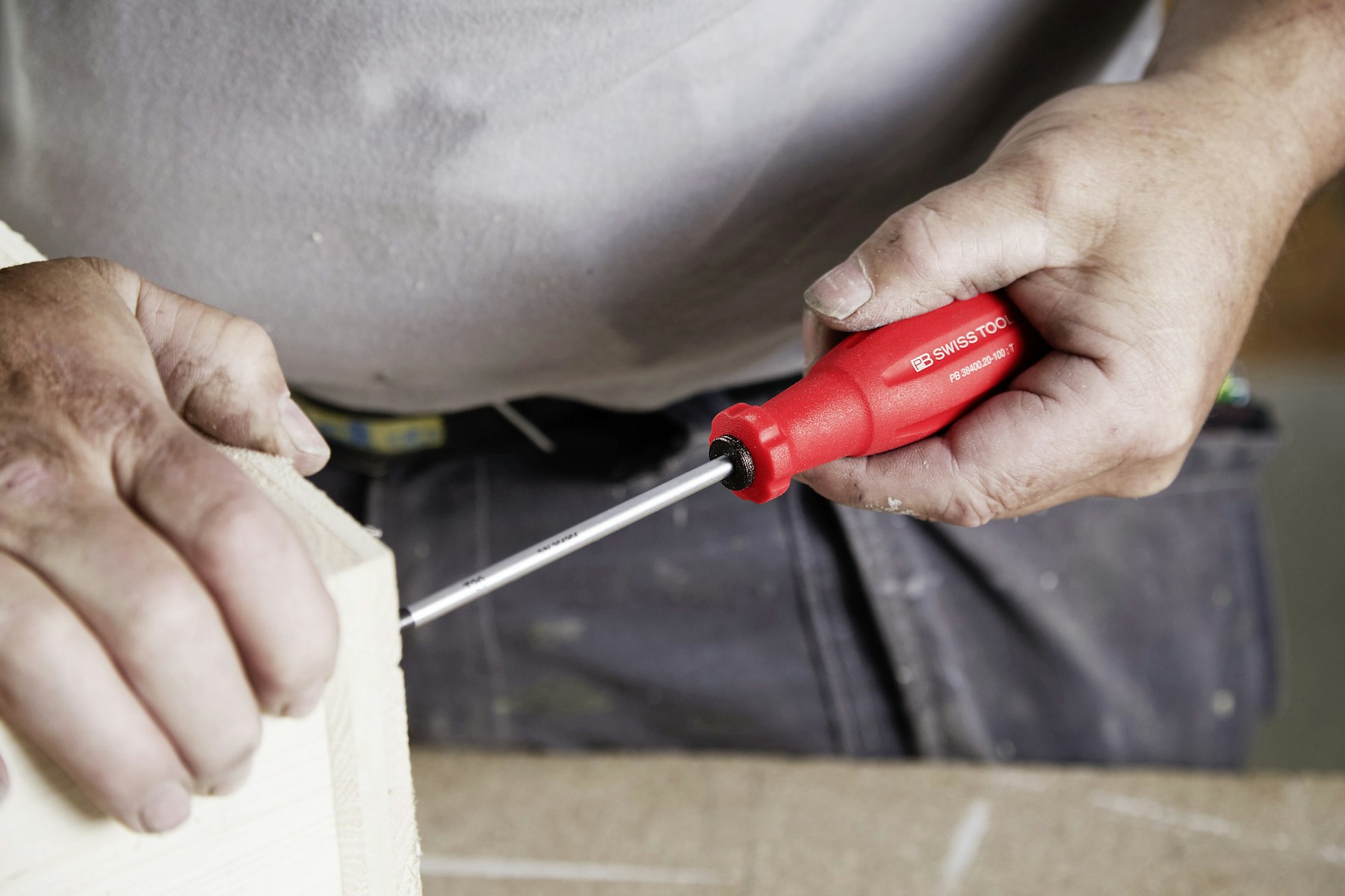 Tradesperson using a screwdriver during home improvement work